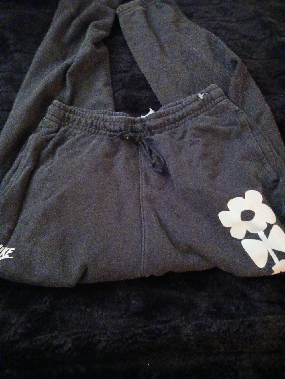 Nike Black Sweatpants with White Flower Graphic